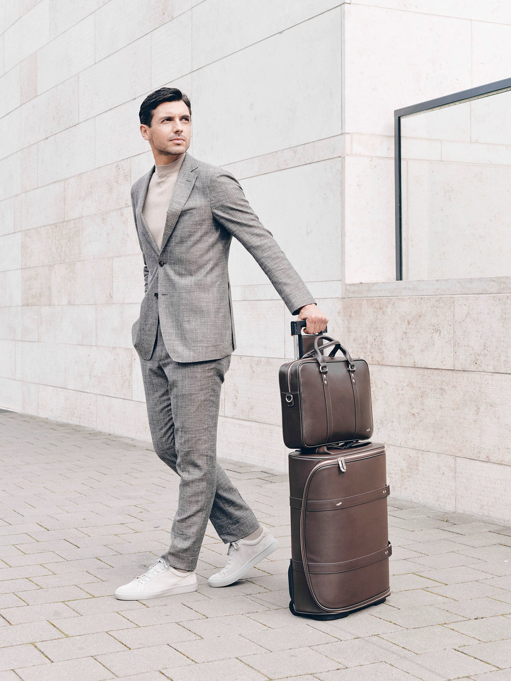 male model with f38 brown leather carry-on luggage and f25 business briefcase brown leather braunes leder